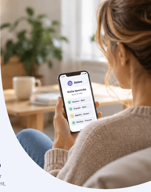 A family carer reads an Aideo report on her phone